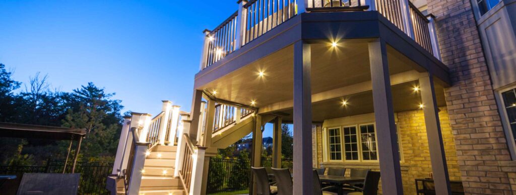 Night deck lighting with step lights for safety, ceiling lights for using the space below, and post lights illuminating the perimeter