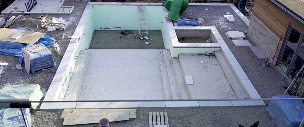 Insulated concrete form pool build featuring thermal insulation walls and strong concrete shell