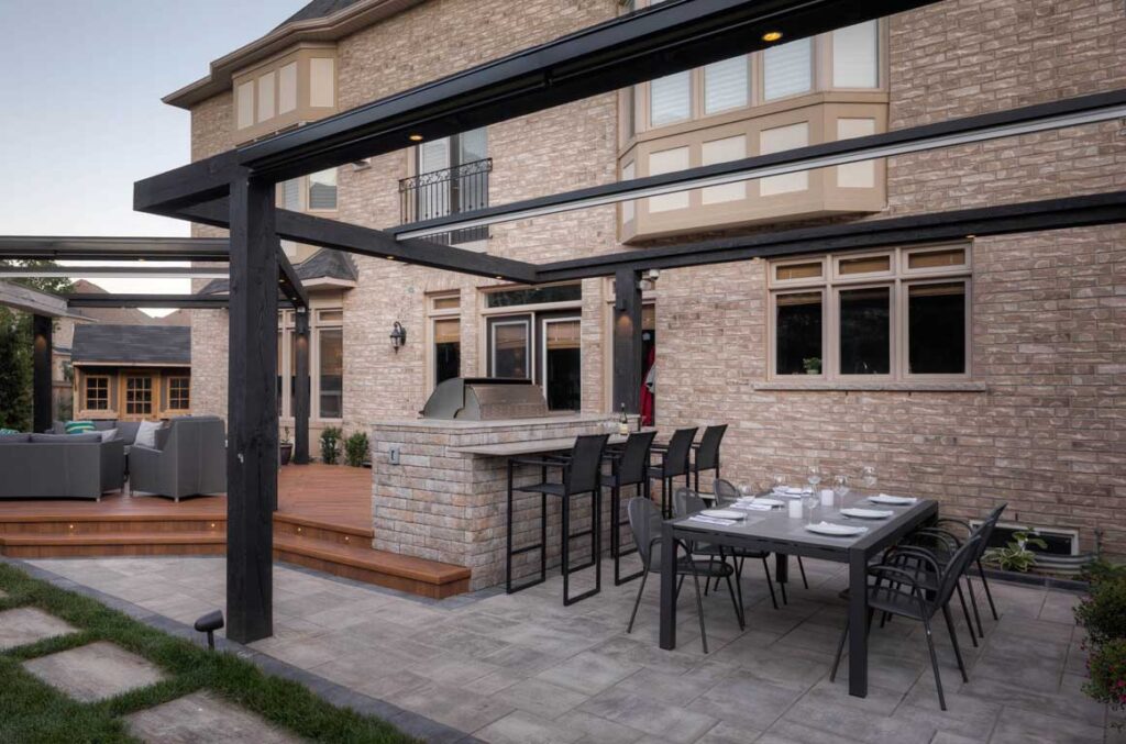 mississauga stone patio with a deck and pergola