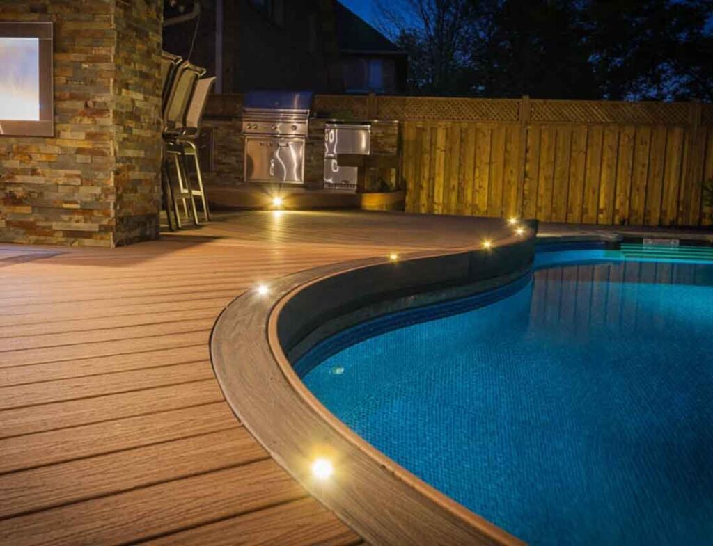 backyard with a pool with a deck built to the edge of pool