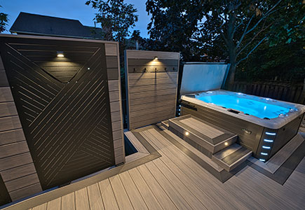 Multi-level modern deck on Rosefield Ct with a louvered pergola, fire table, privacy screens, integrated lighting, and upper BBQ area.
