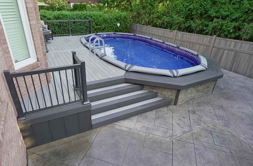 Above ground pool with PVC deck surrounding it, featuring a bar area and barefoot-friendly surface