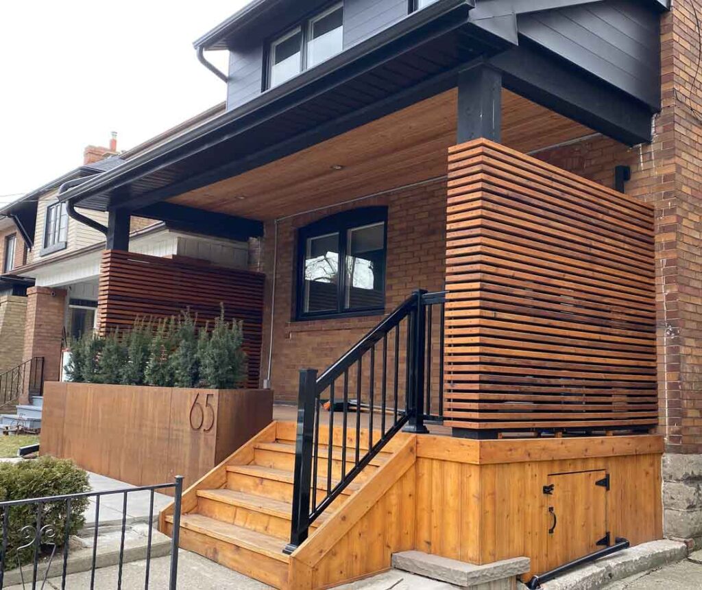 Cedar front porch in Toronto with modern horizontal privacy screens and a corten steel planter