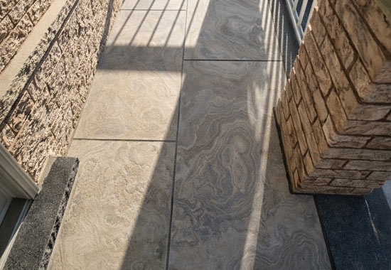 Narrow front porch finished with high-end porcelain tile in Oakville, offering superior durability and a refined, low-maintenance premium finish.