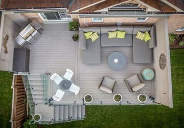 Aerial view of a second-floor deck with well-planned furniture arrangement