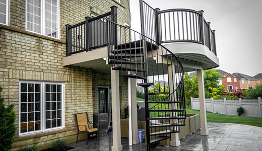 Second-floor deck with spiral staircase and curved deck corners