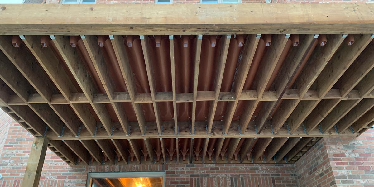 Waterproof deck framing protected during construction to keep the structure dry and extend its lifespan