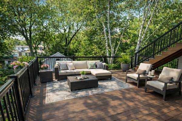 Modern rooftop deck with composite decking and cozy lounging area, ideal backyard space where rooftop is the only outdoor option